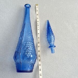 Tall blue vase with stopper